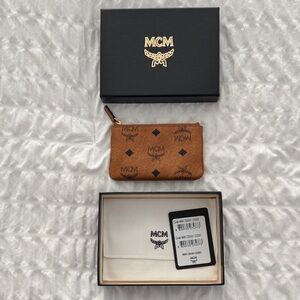 Like New MCM Zip pouch in signature Visetos and nappa leather 
(No Chain)
